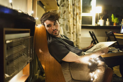 Young man listening to vinyl records