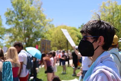 Side view of teen attending rally