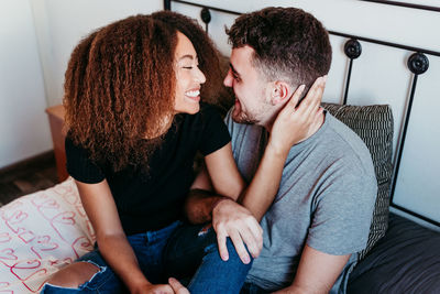 Midsection of couple sitting