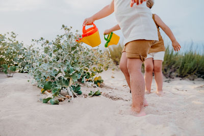 Rear view of woman walking on beach