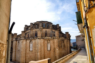 Low angle view of old building against sky