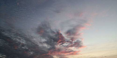 Low angle view of dramatic sky during sunset