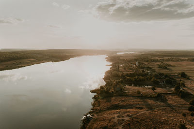 Scenic view of landscape against sky during sunset