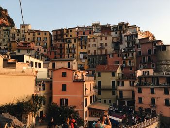 Buildings in city against clear sky