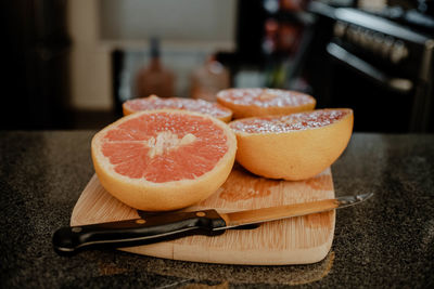 Close-up of orange fruits on cutting board