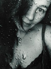 Young woman with rain drops