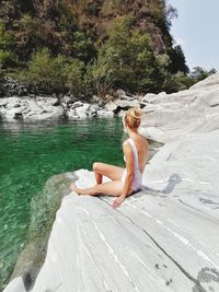Woman sitting in water