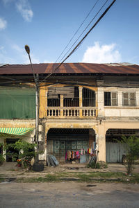 Street by building against sky