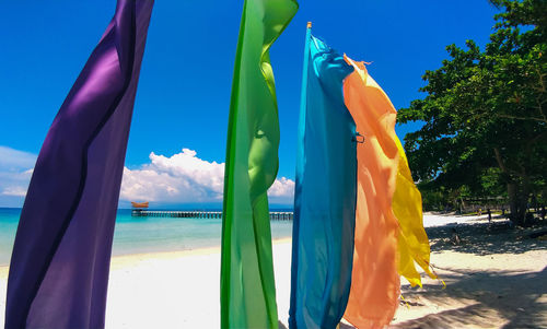 Scenic view of beach against blue sky