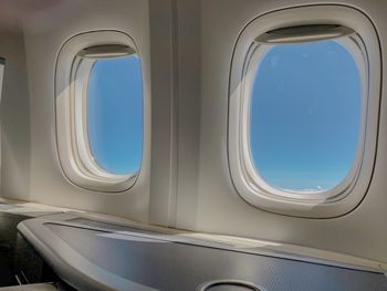 Blue sky seen through airplane window