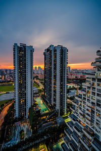 High angle view of buildings in city against sky during sunset