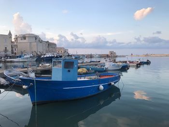 Boats moored at harbor