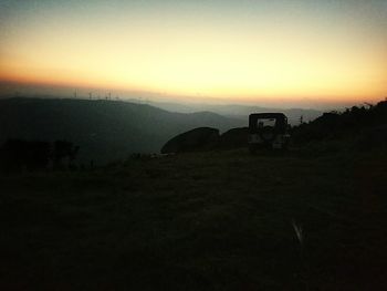 Scenic view of landscape at sunset