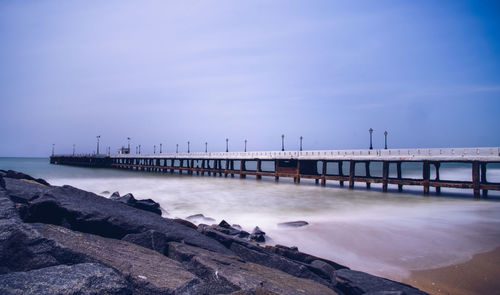 Pier over sea against sky