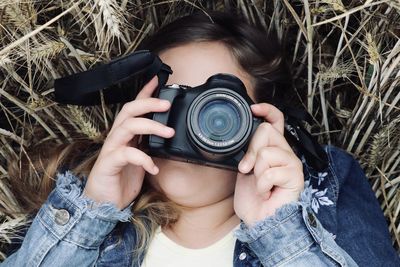 Portrait of woman photographing