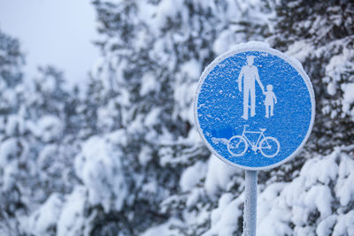 Close-up of road sign on snow
