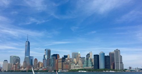 East river against one world trade center amidst towers at manhattan