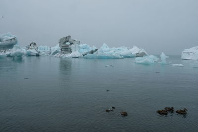 Scenic view of frozen lake against sky