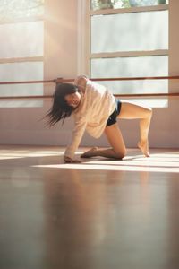 Young woman dancing at home