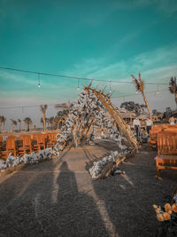 Cars on road against sky in city