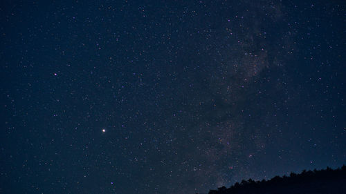 Low angle view of stars against sky at night