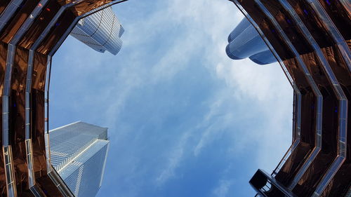 Low angle view of buildings against cloudy sky