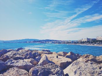 Scenic view of sea against cloudy sky