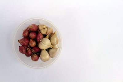 High angle view of strawberries in bowl on table