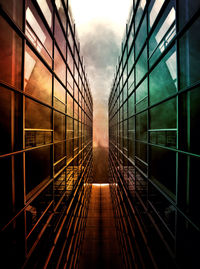 View of modern building against cloudy sky
