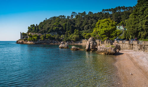 Scenic view of sea against clear blue sky