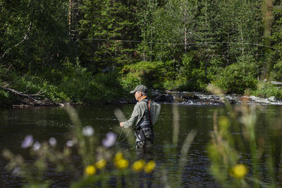 Man fishing in river