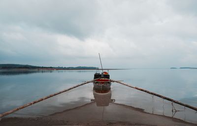 Boat on sea against sky