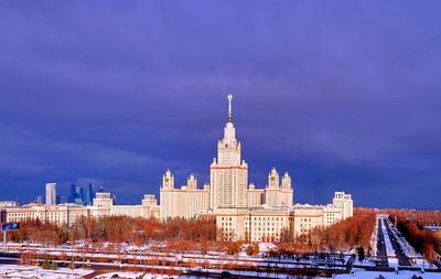 Sunset winter campus of moscow university under heavy dramatic clouds