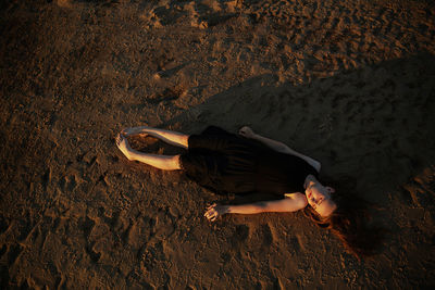 High angle view of teenage girl relaxing on land