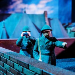 Close-up of female statue against blue toy