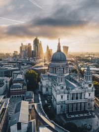 High angle view of cityscape against cloudy sky