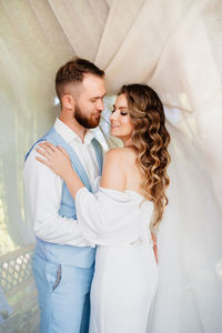 Young couple standing outdoors