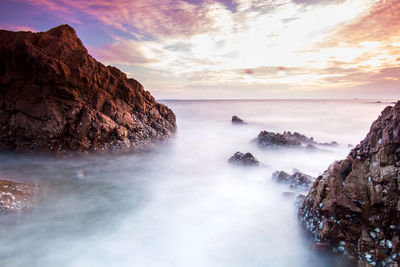 Scenic view of sea against sky during sunset