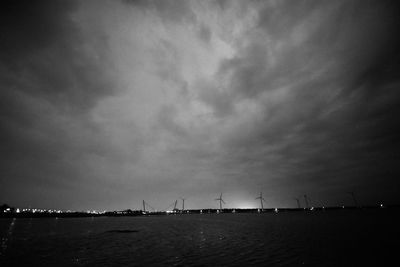 Sailboats sailing in sea against sky