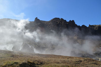 Hot steaming landscape over hot springs and natural fumaroles in iceland.