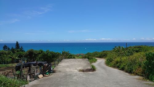 Scenic view of sea against blue sky