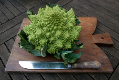 High angle view of romanesco broccoli on cutting board