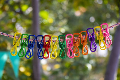 Close-up of decoration hanging on rope