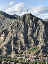 Scenic view of mountain against cloudy sky