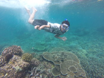 Man swimming in sea