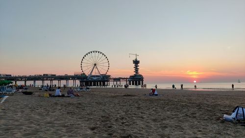 Scenic view of beach against sky during sunset