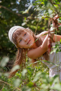 Beautiful girl in the garden in summer