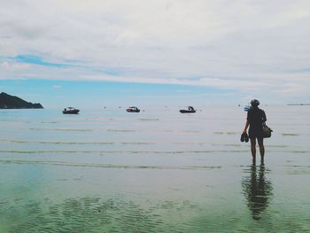 Silhouette of woman in sea