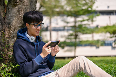 Young man using mobile phone