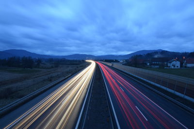 View of highway against cloudy sky